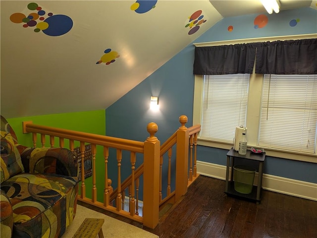 interior space with lofted ceiling and hardwood / wood-style flooring