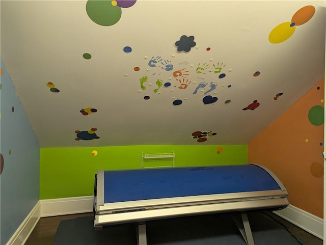 playroom with vaulted ceiling