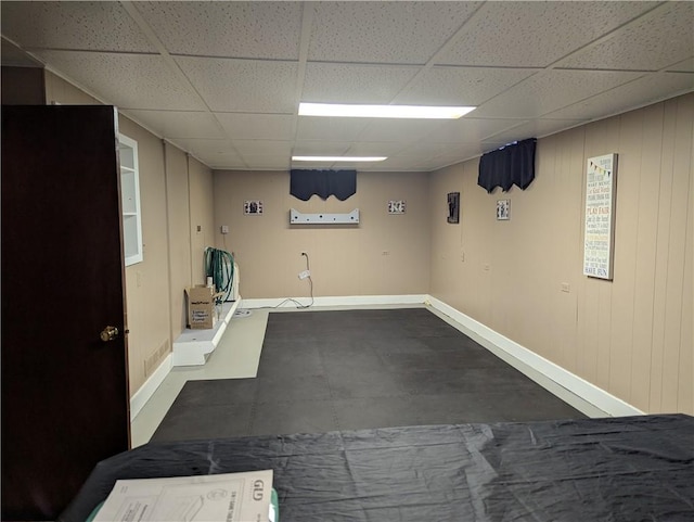 basement featuring a paneled ceiling