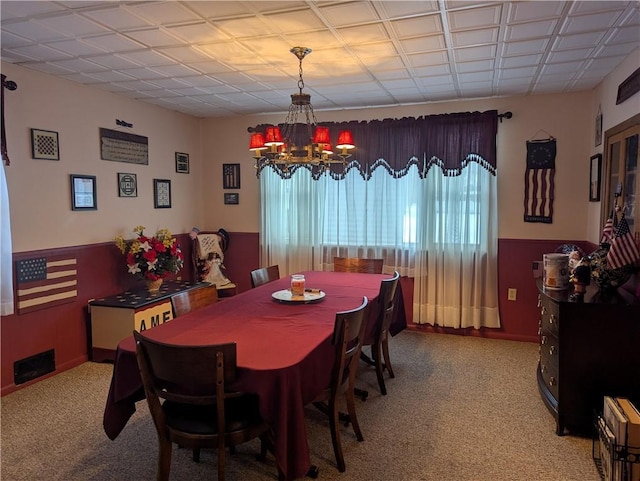 dining area featuring an inviting chandelier