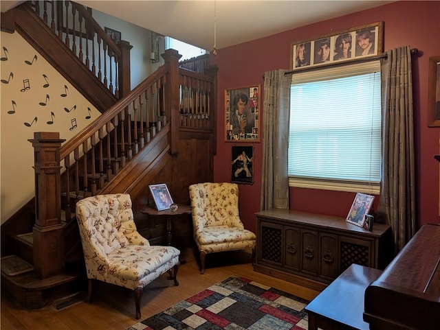 living area with hardwood / wood-style floors