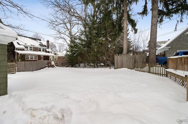 view of yard layered in snow