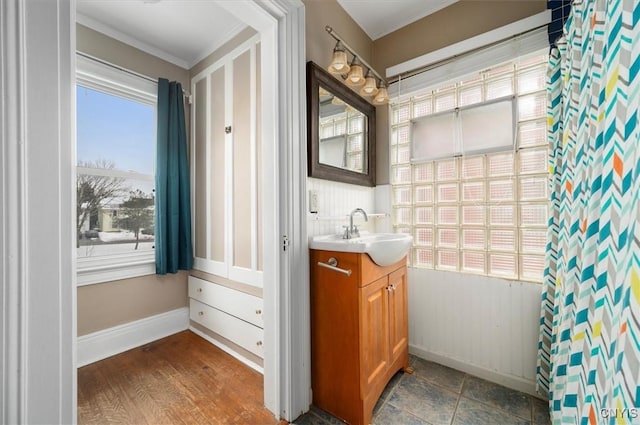 bathroom with vanity and ornamental molding