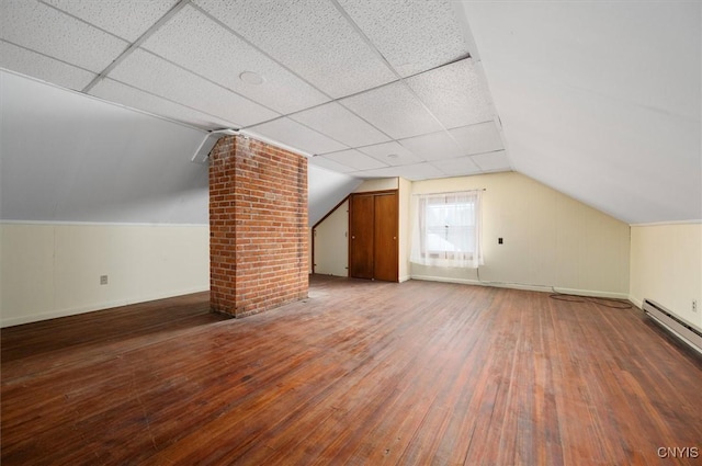 bonus room featuring lofted ceiling, a baseboard radiator, and hardwood / wood-style floors