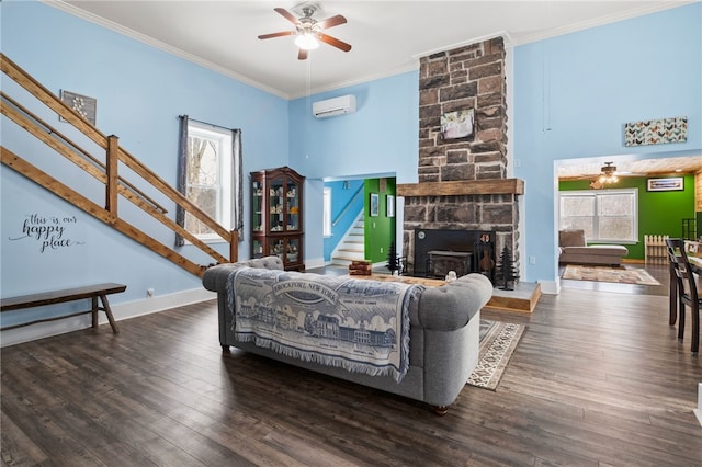 living room with ornamental molding, an AC wall unit, dark wood-type flooring, and ceiling fan