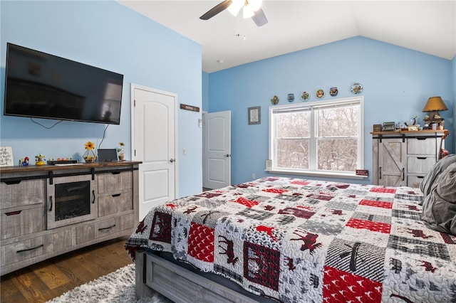 bedroom with vaulted ceiling, dark hardwood / wood-style floors, and ceiling fan