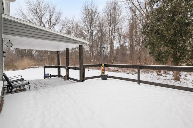 view of snow covered deck