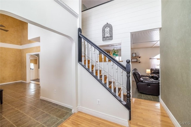 stairway featuring wood-type flooring