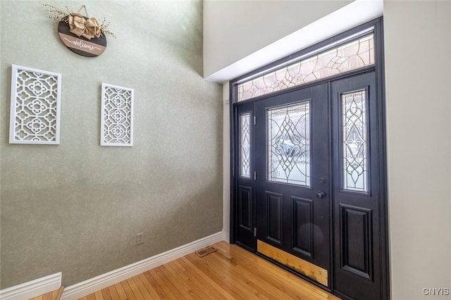 foyer entrance featuring hardwood / wood-style floors