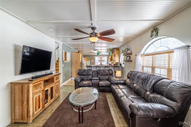 living room with ceiling fan, tile patterned flooring, and a wealth of natural light