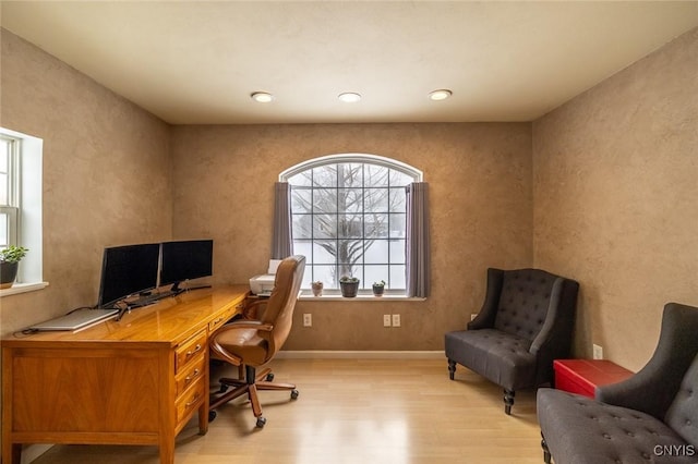 office space with light wood-type flooring