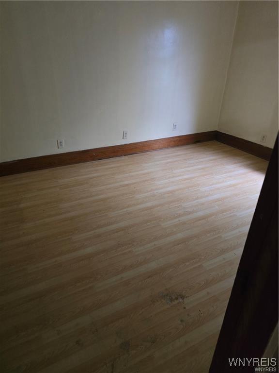 empty room with light wood-type flooring