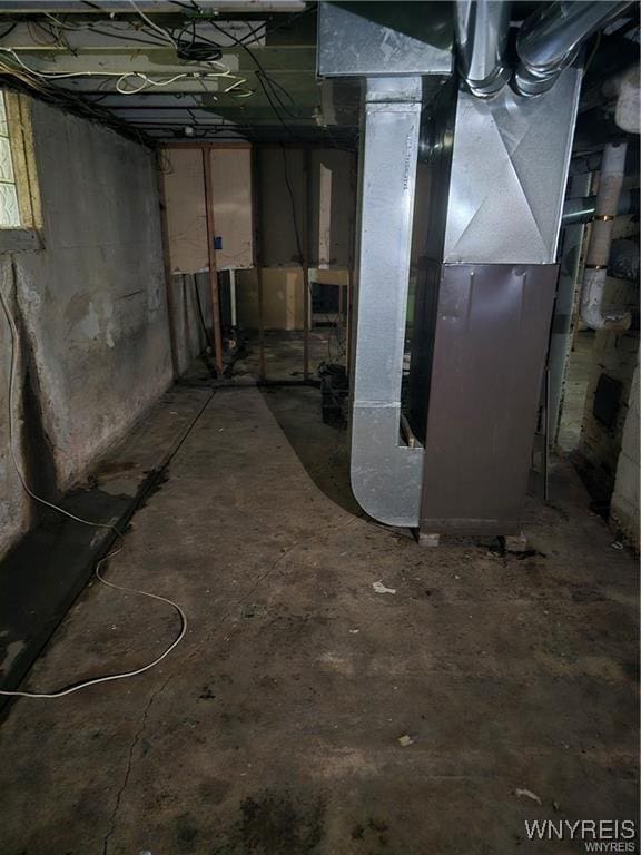 basement featuring heating unit