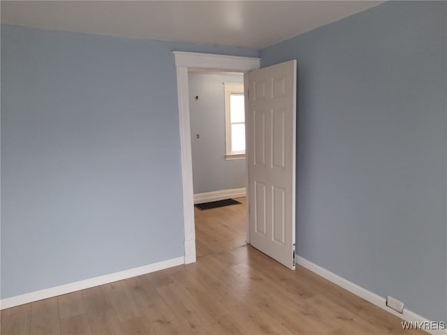 unfurnished room with light hardwood / wood-style flooring