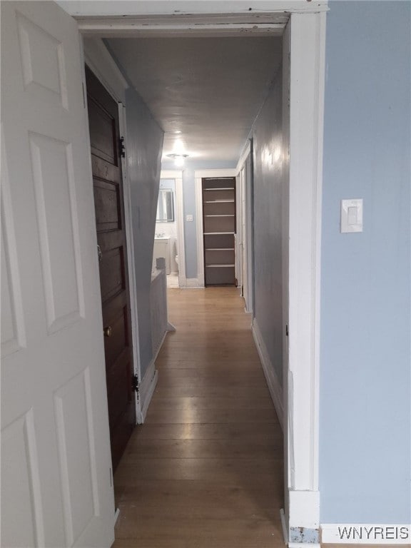 hallway with light hardwood / wood-style flooring