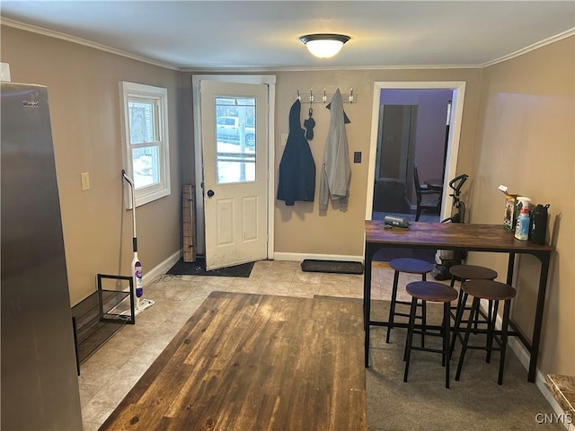 interior space featuring light tile patterned floors and crown molding