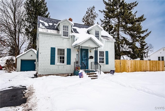 view of front of house featuring an outbuilding and a garage