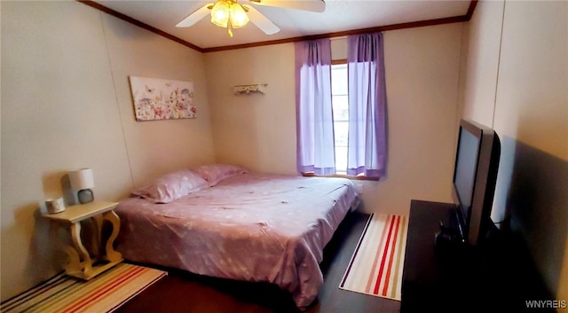 bedroom with crown molding and ceiling fan