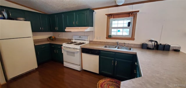 kitchen featuring white appliances, dark hardwood / wood-style flooring, sink, and a textured ceiling