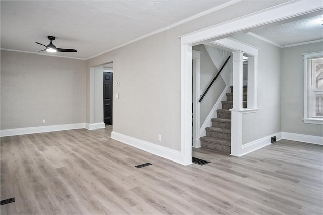 unfurnished room with ceiling fan, a textured ceiling, ornamental molding, and light hardwood / wood-style floors