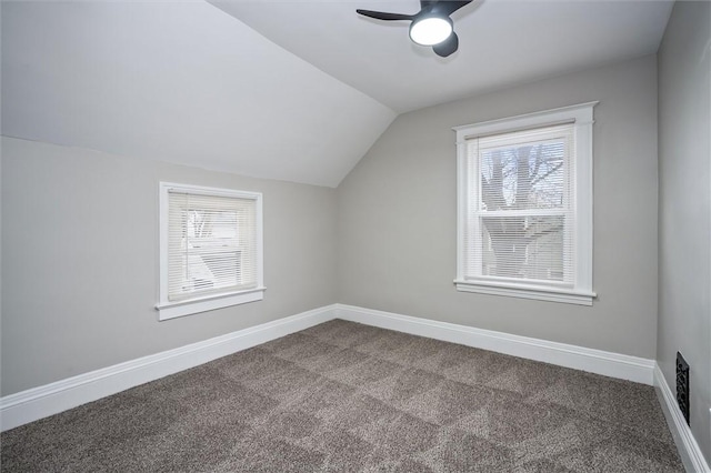 additional living space featuring ceiling fan, vaulted ceiling, and carpet flooring