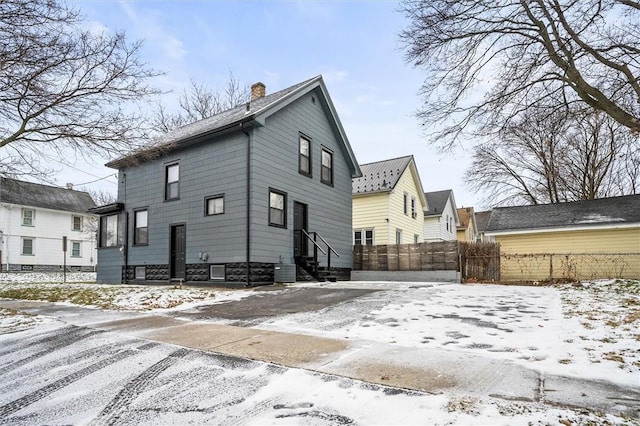 view of snow covered house