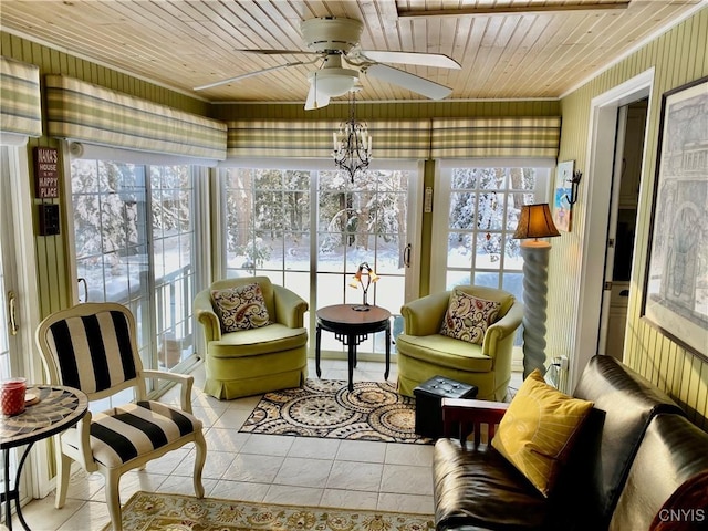 sunroom / solarium featuring ceiling fan, a wealth of natural light, and wooden ceiling