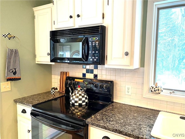 kitchen featuring white cabinetry, decorative backsplash, and black appliances