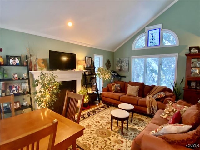 living room with vaulted ceiling and ornamental molding