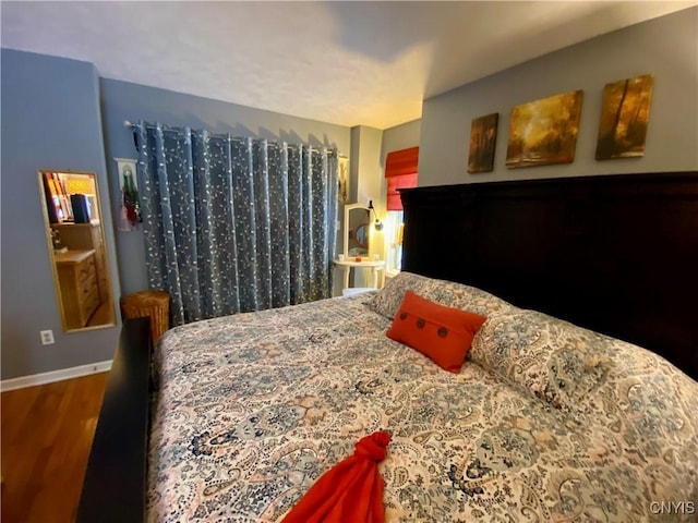 bedroom featuring wood-type flooring