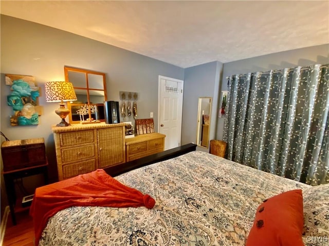 bedroom with wood-type flooring