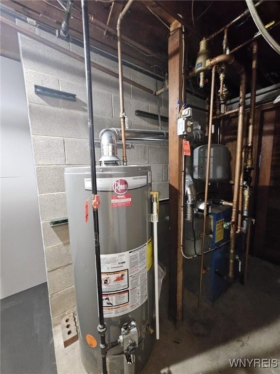 utility room featuring water heater