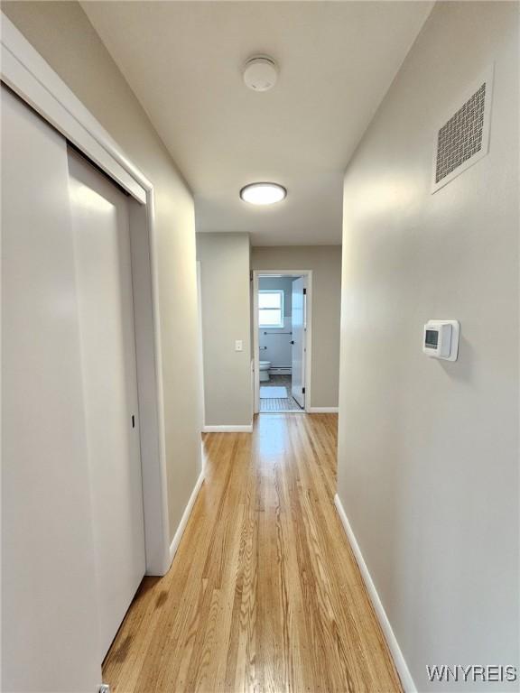 corridor featuring light wood-type flooring