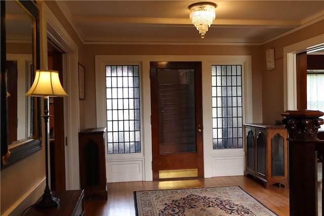 doorway featuring dark wood-type flooring and a chandelier