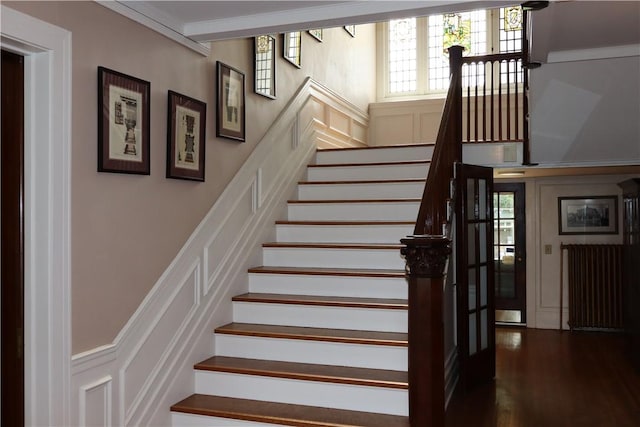 stairway featuring crown molding