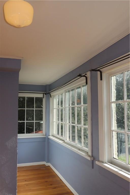 unfurnished sunroom featuring plenty of natural light