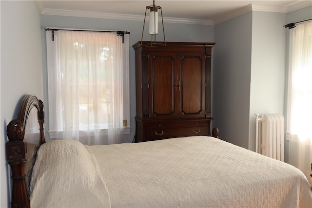 bedroom featuring radiator and ornamental molding