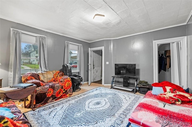 living room with crown molding and light colored carpet