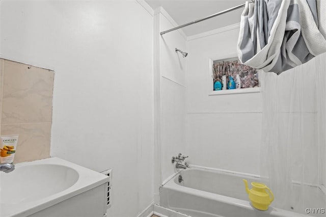 bathroom with sink and crown molding