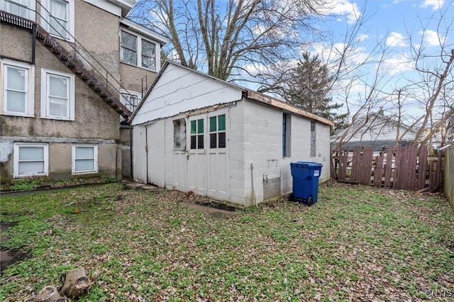 view of home's exterior featuring an outbuilding and a yard