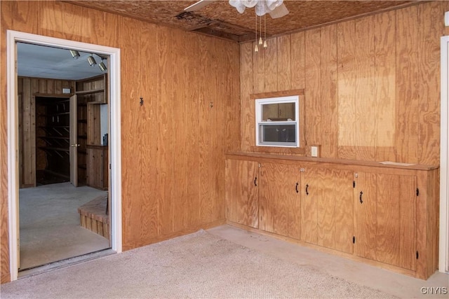 unfurnished room with wooden walls