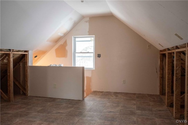 additional living space with vaulted ceiling