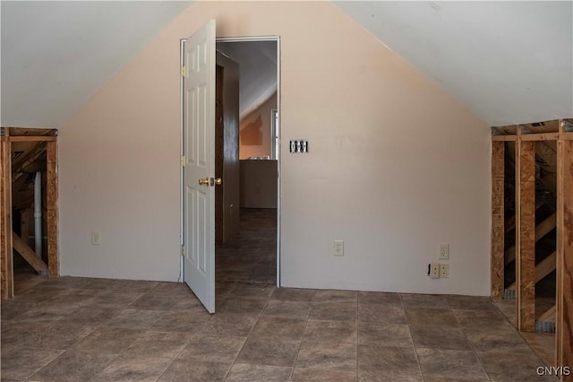 additional living space with vaulted ceiling