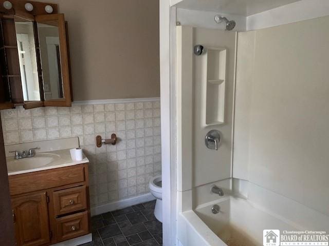 full bathroom with toilet, vanity, and shower / bathing tub combination