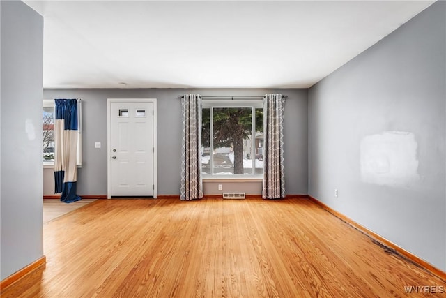 spare room featuring light wood-type flooring