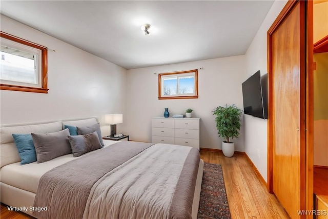 bedroom with light hardwood / wood-style floors