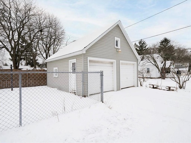 view of snow covered garage