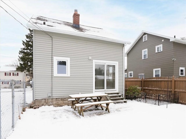 view of snow covered property