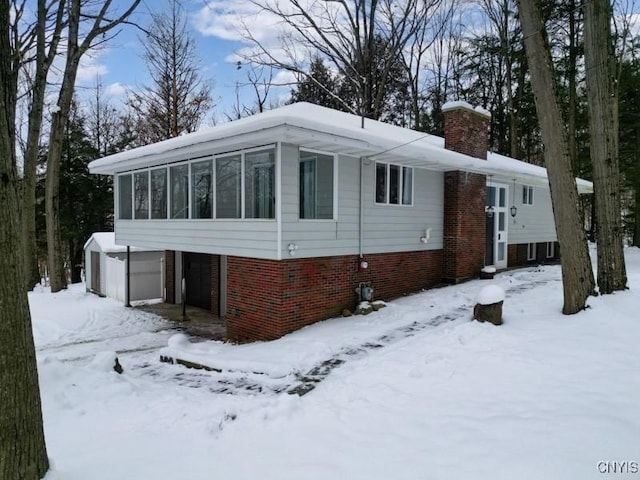 view of front facade with a sunroom