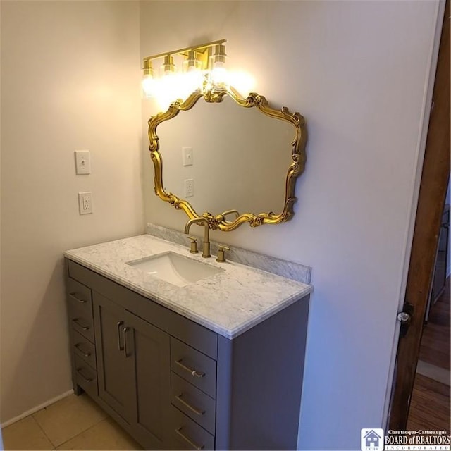 bathroom with tile patterned floors and vanity